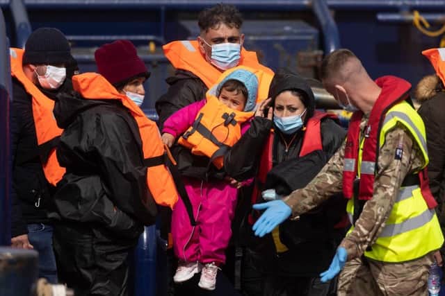 Migrants arrive at Dover port after being picked up in the channel by the  border force yesterday in Dover, England.