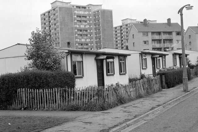 The newly-constructed Comiston multi-storey flats at Oxgangs. Prefabs shown in foreground.