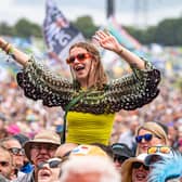 Crowds watch Olivia Dean perform on the pyramid stage at Glastonbury Festival at Worthy Farm in Somerset.