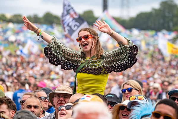 Crowds watch Olivia Dean perform on the pyramid stage at Glastonbury Festival at Worthy Farm in Somerset.