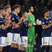 Scotland plyers during a minute's applause paying tribute to Queen Elizabeth II ahead of the match against Ukraine.  (Photo by Craig Foy / SNS Group)