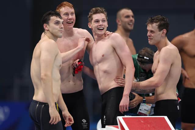 Tom Dean, James Guy, Matthew Richards and Duncan Scott react after winning the men's 4 x 200m freestyle relay final for Britain at the Tokyo 2020 Olympics. Picture: Tom Pennington/Getty Images