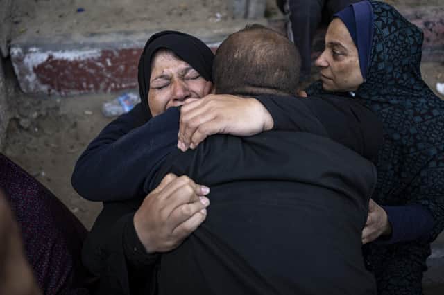 Palestinians in the hospital in Khan Younis mourn relatives killed in the Israeli bombardment of the Gaza Strip. Picture: Fatima Shbair/AP