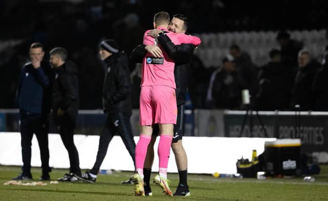 St Mirren goalkeeper Jamie Langfield (R) celebrates with goalkeeper Trevor Carson after winning the shootout against Dundee,