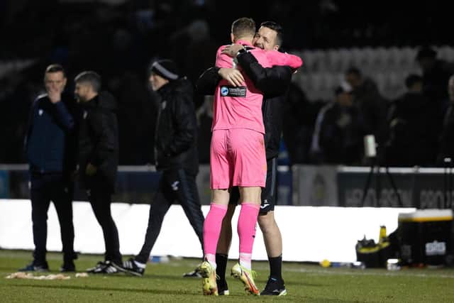 St Mirren goalkeeper Jamie Langfield (R) celebrates with goalkeeper Trevor Carson after winning the shootout against Dundee,