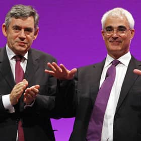Alastair Darling receives applause from Prime Minister Gordon Brown after making his speech during the 2008 Labour Party Conference in Manchester