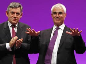 Alastair Darling receives applause from Prime Minister Gordon Brown after making his speech during the 2008 Labour Party Conference in Manchester