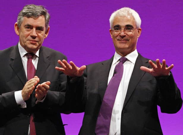Alastair Darling receives applause from Prime Minister Gordon Brown after making his speech during the 2008 Labour Party Conference in Manchester