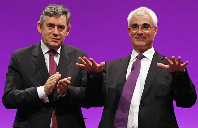 Alastair Darling receives applause from Prime Minister Gordon Brown after making his speech during the 2008 Labour Party Conference in Manchester