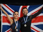 Britain's Lilah Fear and Lewis Gibson pose with a flag during the victory ceremony after the Ice Dance event of the ISU European Figure Skating Championships in Espoo, Finland.