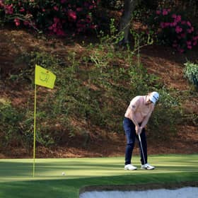 Bob MacIntyre on the 12th green as Sandy Lyle of Scotland looks on during a practice round prior to the 2022 Masters at Augusta National Golf Club. Picture: David Cannon/Getty Images.