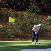 Bob MacIntyre on the 12th green as Sandy Lyle of Scotland looks on during a practice round prior to the 2022 Masters at Augusta National Golf Club. Picture: David Cannon/Getty Images.