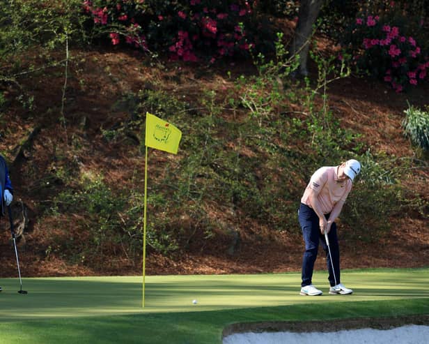 Bob MacIntyre on the 12th green as Sandy Lyle of Scotland looks on during a practice round prior to the 2022 Masters at Augusta National Golf Club. Picture: David Cannon/Getty Images.