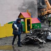 Wreckage from a crashed Ukrainian helicopter lies next to a kindergarten in Brovary, outside the capital Kyiv (Picture: Sergei Supinsky/AFP via Getty Images)
