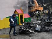 Wreckage from a crashed Ukrainian helicopter lies next to a kindergarten in Brovary, outside the capital Kyiv (Picture: Sergei Supinsky/AFP via Getty Images)