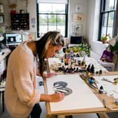 Catherine Rayner working in her studio