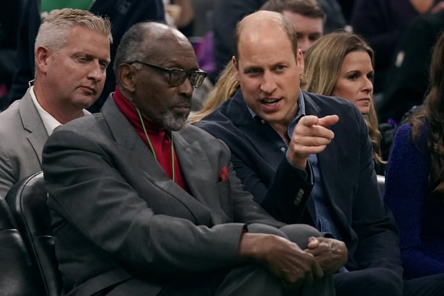 Britain's Prince William talks with former Boston Celtics player Satch Sanders.