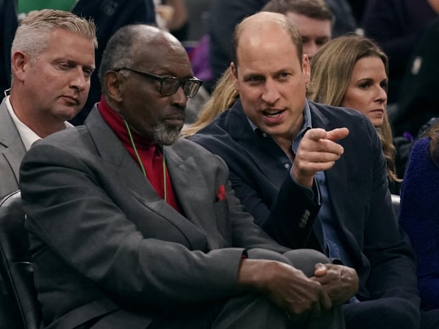 Britain's Prince William talks with former Boston Celtics player Satch Sanders.