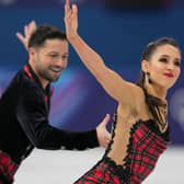 Lilah Fear and Lewis Gibson of Britain compete during the ice dancing free skate in figure skating at the 2026 Winter Olympics. (AP Photo/Stephanie Scarbrough)