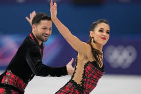Lilah Fear and Lewis Gibson of Britain compete during the ice dancing free skate in figure skating at the 2026 Winter Olympics. (AP Photo/Stephanie Scarbrough)