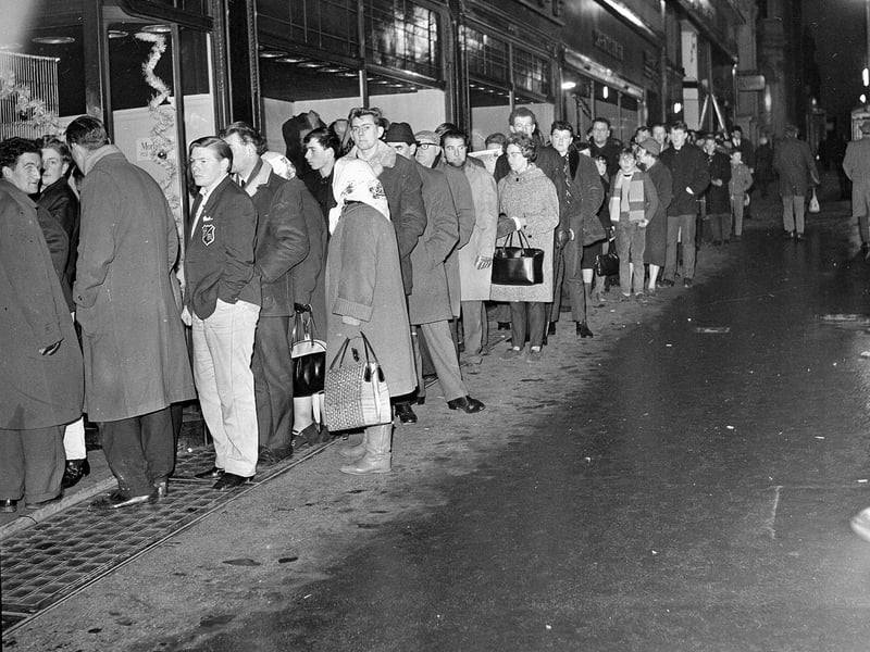 People queue outtside Mackenzie's sport shop in Nicolson Street for tickets to the Hearts v Hibs Edinburgh Derby match to be played at Tynecastle on New Year's day 1965.