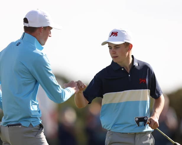 Calum Scott, left, and Connor Graham react during the Saturday Foursomes on day one of the 49th Walker Cup at St Andrews. Picture: Oisin Keniry/R&A/R&A via Getty Images.