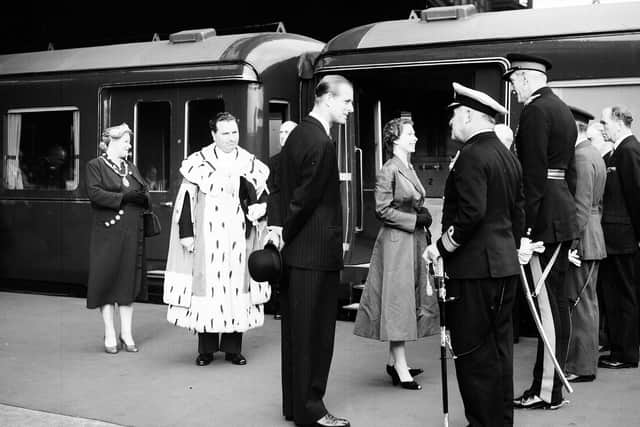 The Queen and Duke of Edinburgh boarding the train at Princes Street Station in Edinburgh during their Coronation visit in 1953