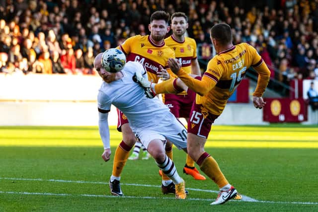 Hearts were denied a penalty when Liam Boyce went down under a tackle from Motherwell's Dan Casey. (Photo by Craig Foy / SNS Group)