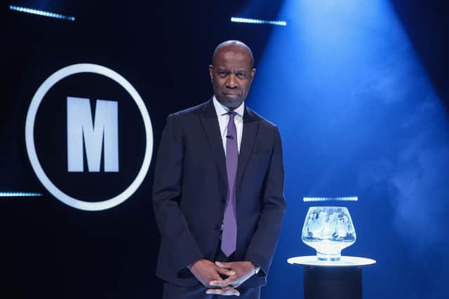 Mastermind presenter Clive Myrie with iconic glass bowl trophy