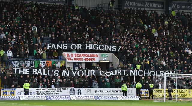 Celtic fans protest against Bernard Higgins during the cinch Premiership match against Dundee.