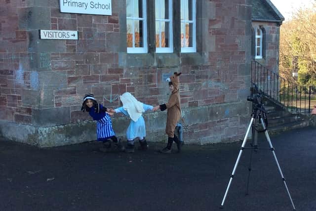 Mary and Joseph dragging a somewhat reluctant donkey at Seton Primary