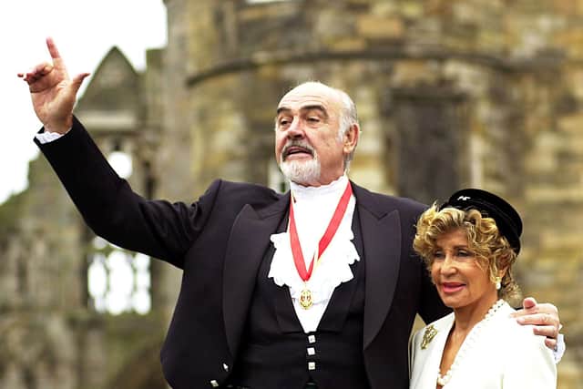 Sir Sean Connery with wife Micheline at the Palace of Holyroodhouse, Edinburgh, in July 2000, after he was formally knighted by the Queen during a ceremony in his home city.