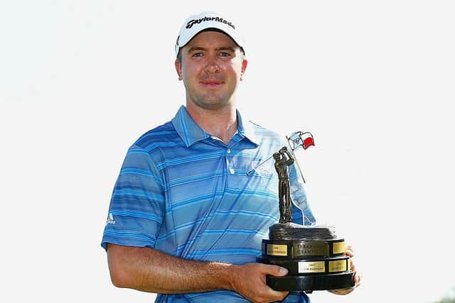 Martin Laird holds the trophy after winning the 2013 Valero Texas Open at TPC San Antonio. Picture: Michael Cohen/Getty Images.