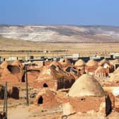 This shows traditional mud-brick houses known as 'beehive houses' in the village of Umm Amuda al-Kabira in Aleppo's eastern countryside, north of Damascus, Syria. Syria has been ranked the country at the bottom of the Human Freedom Index.