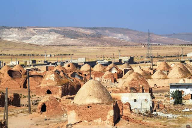 This shows traditional mud-brick houses known as 'beehive houses' in the village of Umm Amuda al-Kabira in Aleppo's eastern countryside, north of Damascus, Syria. Syria has been ranked the country at the bottom of the Human Freedom Index.
