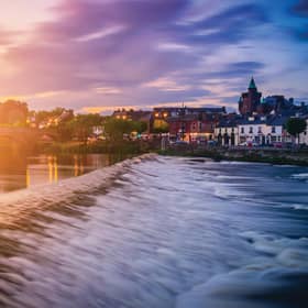 The River Nith and old bridge at sunset in Dumfries, Scotland, UK.