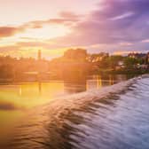 The River Nith and old bridge at sunset in Dumfries, Scotland, UK.