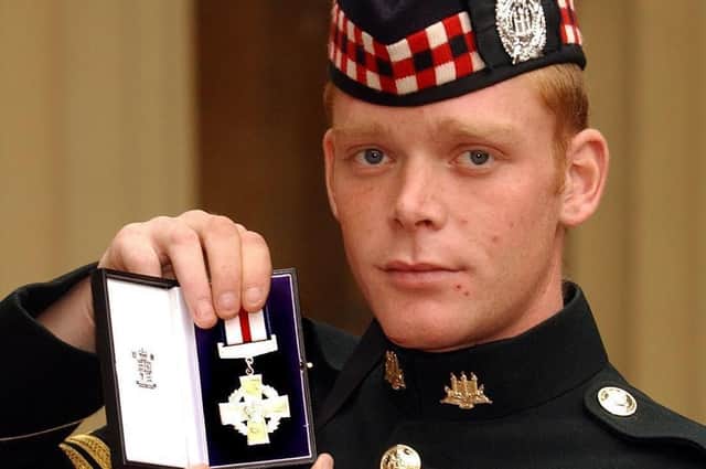 Shaun Jardine, of the King's Own Scottish Borderers, holds his Conspicuous Gallantry Cross (Picture: John Stillwell/PA Wire)