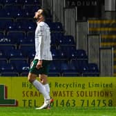 Hibs' Christian Doidge walks off after being shown a red card during a cinch Premiership match against Ross County.