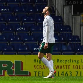 Hibs' Christian Doidge walks off after being shown a red card during a cinch Premiership match against Ross County.