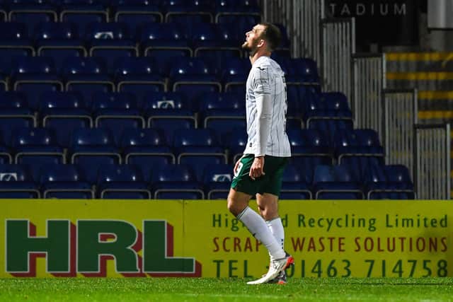 Hibs' Christian Doidge walks off after being shown a red card during a cinch Premiership match against Ross County.