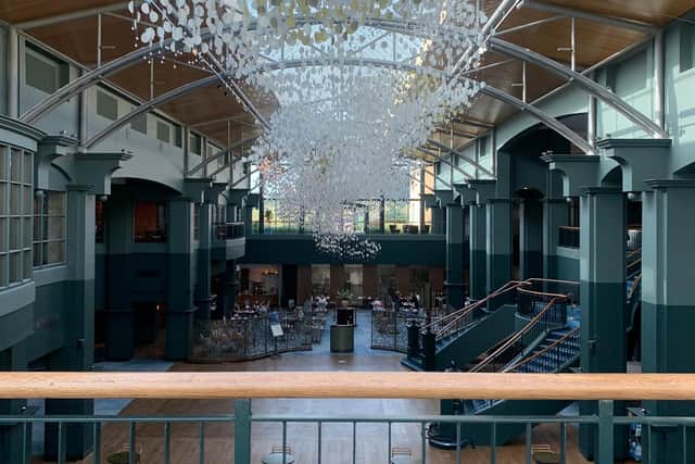 The Atrium with the impressive Zephyr lighting sculpture by artist George Singer, which emulates shoals of fish in St Andrews Bay and the blowing reeds on the cliff tops nearby.
