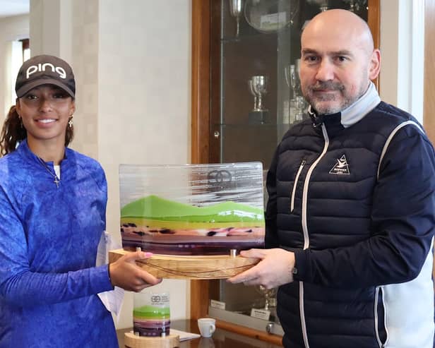 Woburn's Roisin Scanlon is presented with the trophy by the Northumberland club's general manager Keith Martin after winning the Stephen Gallacher Foundation Goswick Links Classic for the second year in a row. Picture: SGF