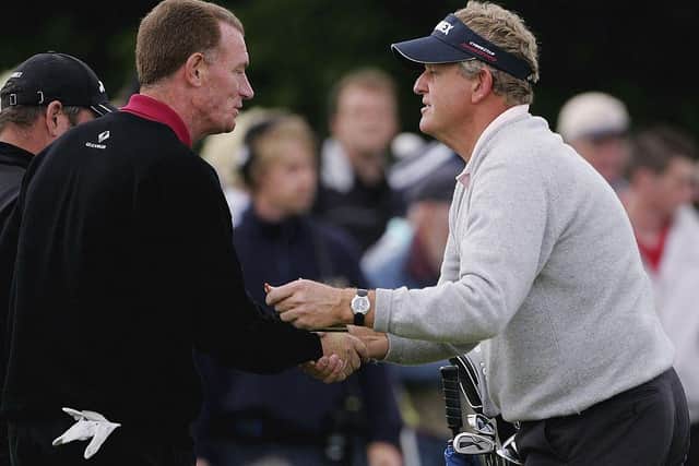Gordon Law, left, shakes hands with Colin Montgomerie after the first round of the Johnnie Walker Championship at Gleneagles in 2006. Picture: Andrew Redington/Getty Images.