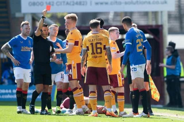 MOTHERWELL, SCOTLAND - APRIL 23: Rangers' Leon Balogun (R) is sent off by referee Nick Walsh for a challenge on Motherwell's Dean Cornelius during a cinch Premiership match between Motherwell and Rangers at Fir Park, on April 23, 2022, in Motherwell, Scotland. (Photo by Craig Foy / SNS Group)