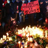 People attend a candlelight vigil for victims of a mass shooting in Monterey Park, California, in January. Eleven people died and nine more were injured (Picture: Mario Tama/Getty Images)