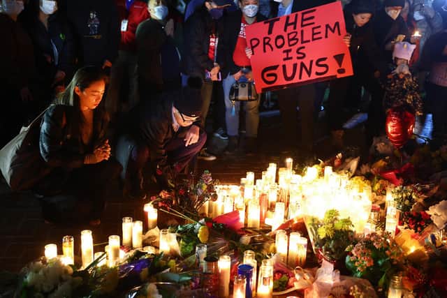 People attend a candlelight vigil for victims of a mass shooting in Monterey Park, California, in January. Eleven people died and nine more were injured (Picture: Mario Tama/Getty Images)