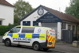 A police vehicle sits outside of A. Milne funeral directors in Balornock, Glasgow. Picture: Andrew Milligan/PA Wire
