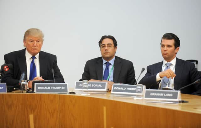George Sorial, centre, at a 2012 Scottish Parliament inquiry into renewable energy, alongside Donald Trump and his eldest son. Picture: Jane Barlow