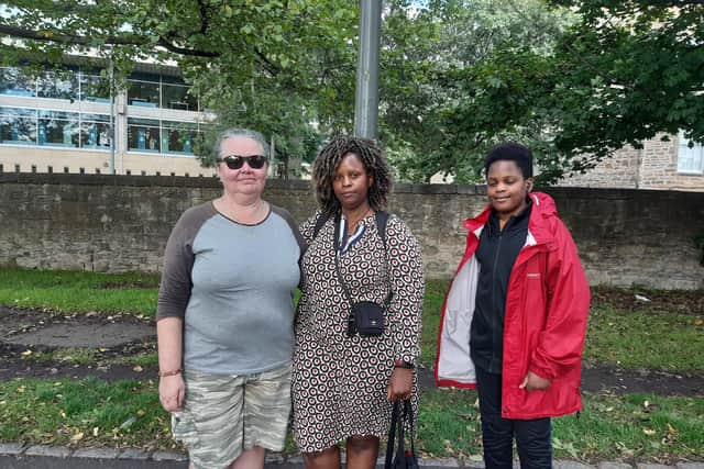 Susanne Frame, from Australia, with Irene Katigi, from Glasgow and her son, Quincy, 12.